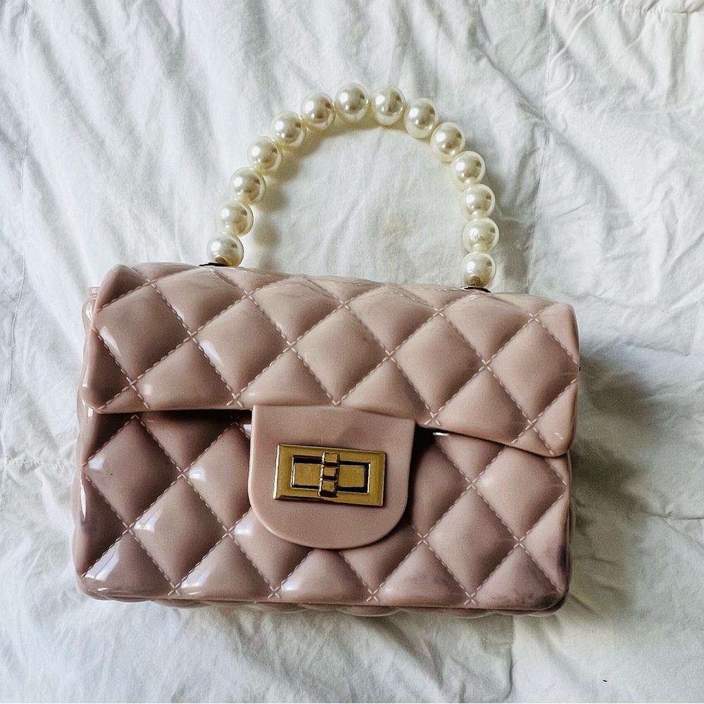 Cute pink faux leather pearl bag with gold buckle